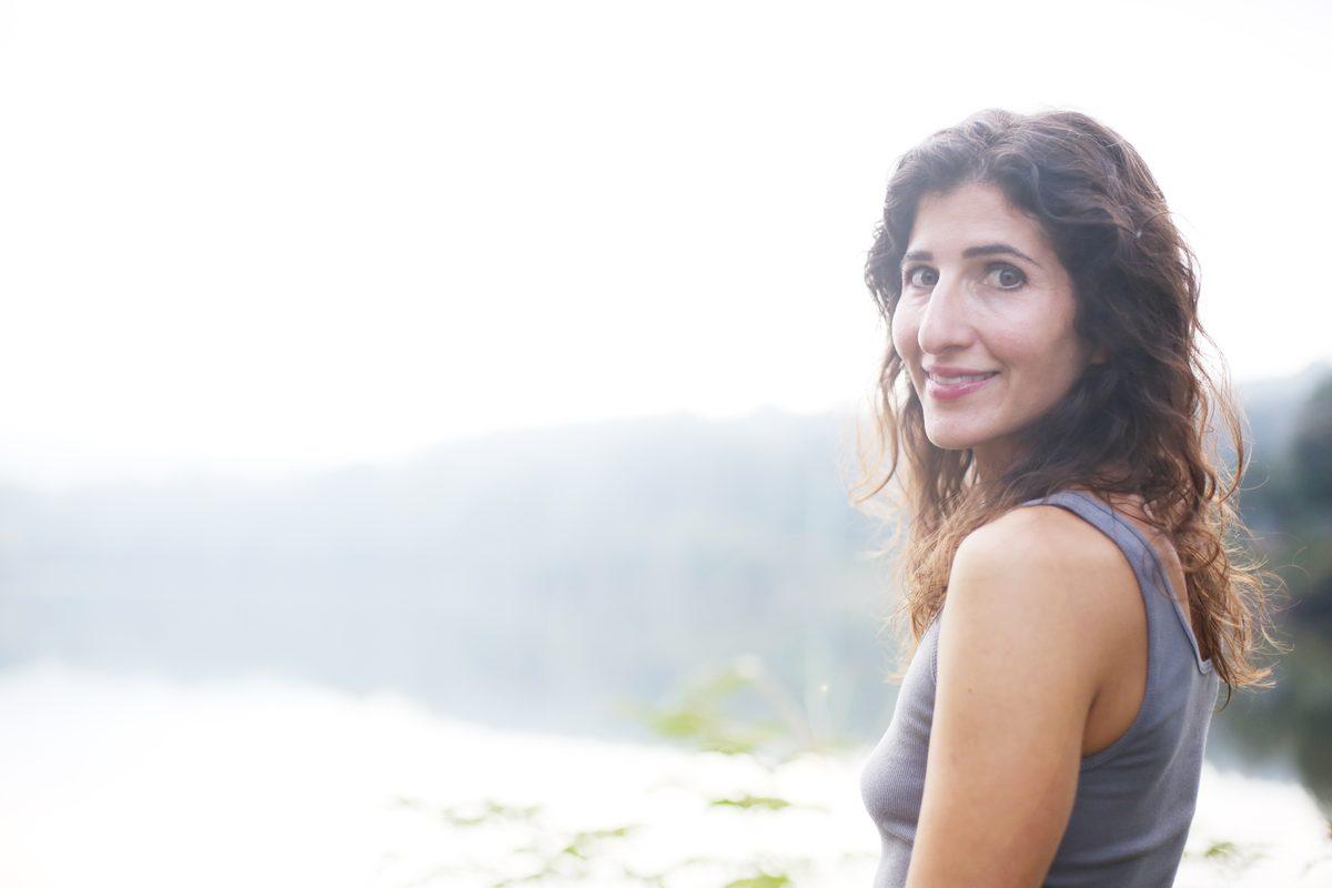 Maro smiling by the lake